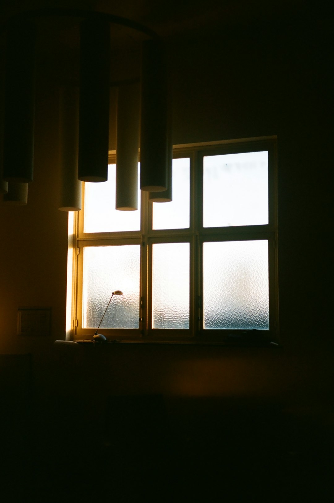 a window with a light shining through it